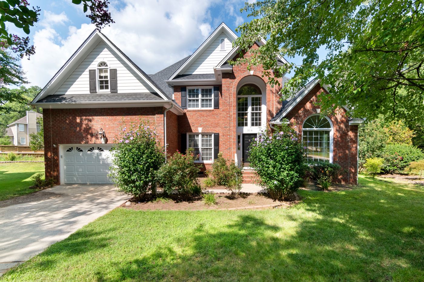 American brick home with newly installed energy-efficient windows